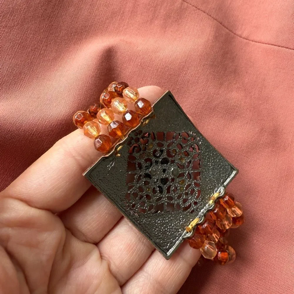 Y2K Multi-stranded Bracelet with a faux Amber Glass, Gems Statement Pendant